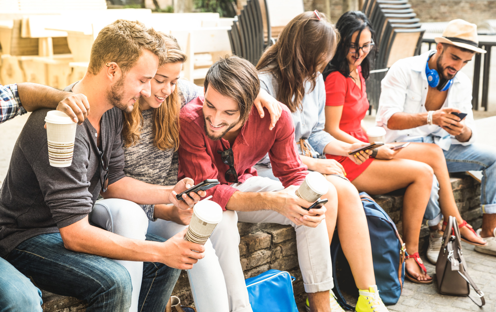 millennials sitting outside