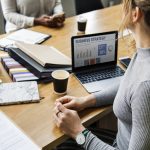 woman at desk with business strategy on computer