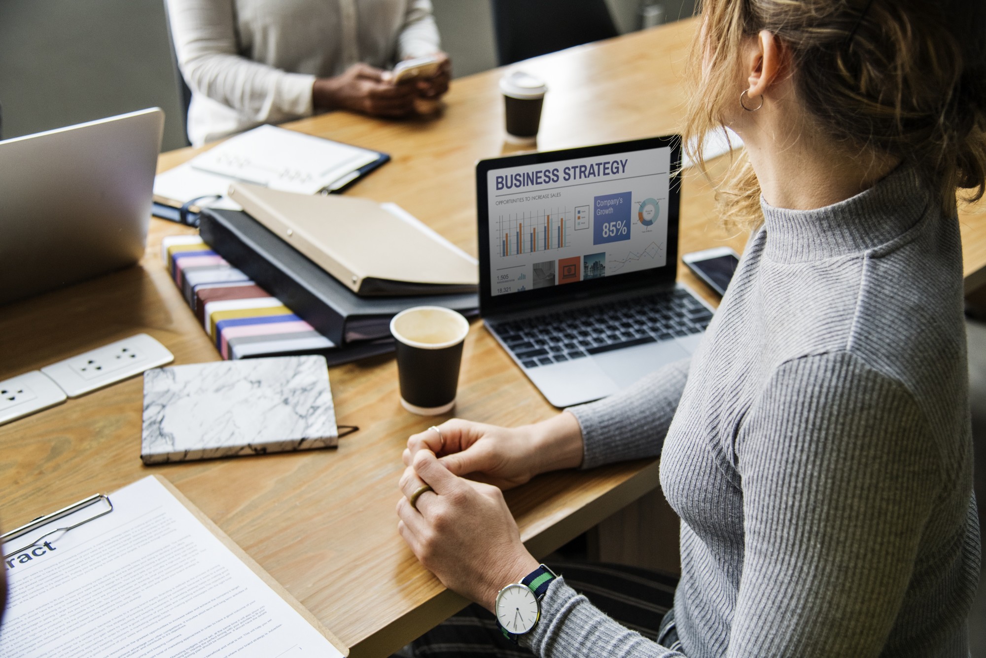 woman at desk with business strategy on computer