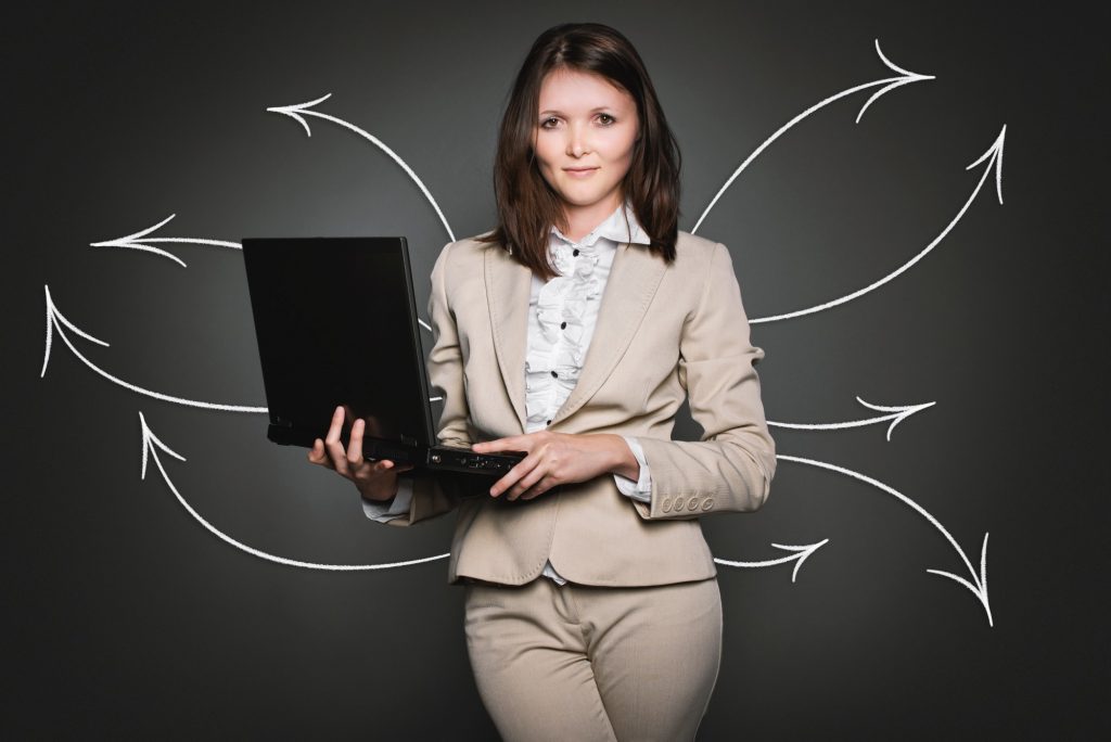 business woman with laptop and arrows