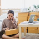 woman shipping boxes from home