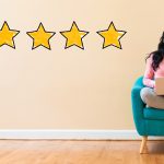 review stars and woman on chair with computer