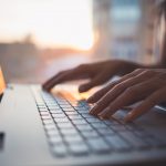 Person Typing on a Laptop